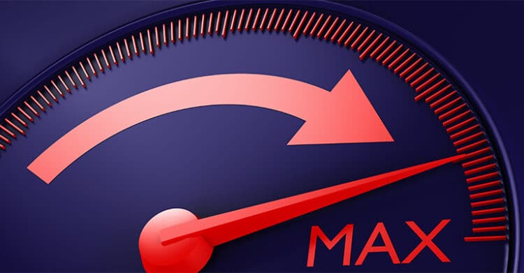 18 Ways to Write Better Blog Posts That Readers Will Finish 7 A close-up of a red gauge needle pointing to the word "MAX" on a dark blue dial, with a bold red arrow arching across the top. This image symbolizes maximum performance or optimization, aligning with the goal of crafting better blog posts that deliver high impact.
