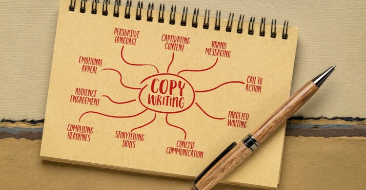 Effective Copywriting: The Core Pillars That Convert 3 Spiral notebook on a desk with a wooden pen resting across the page. In the center, the handwritten phrase "Copy Writing" branches into related terms including "Persuasive Language." "Captivating Content." "Brand Messaging." "Call To Action." "Targeted Writing." "Concise Communication." "Storytelling Skills." "Compelling Headlines." "Audience Engagement." and "Emotional Appeal." illustrating key elements of effective copywriting.