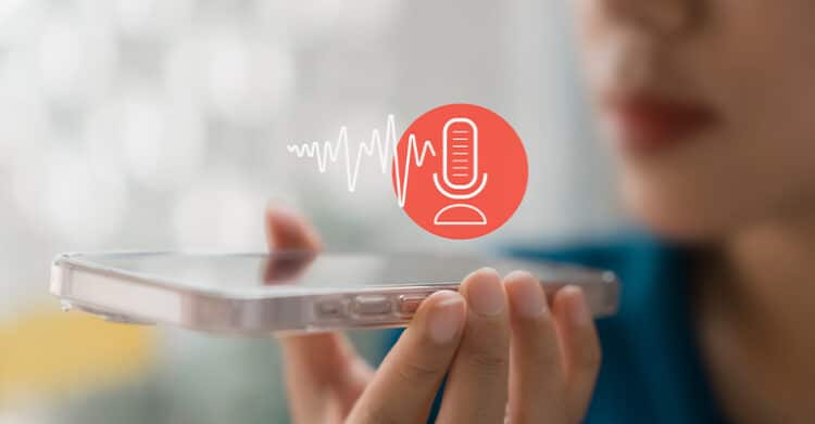 How Does Keyword Length Impact SEO Ranking? 7 A woman holds a smartphone close to her mouth, activating a voice assistant or recording feature, represented by a red microphone icon and audio wave graphic. The image highlights voice search, digital assistants, or hands-free mobile technology.