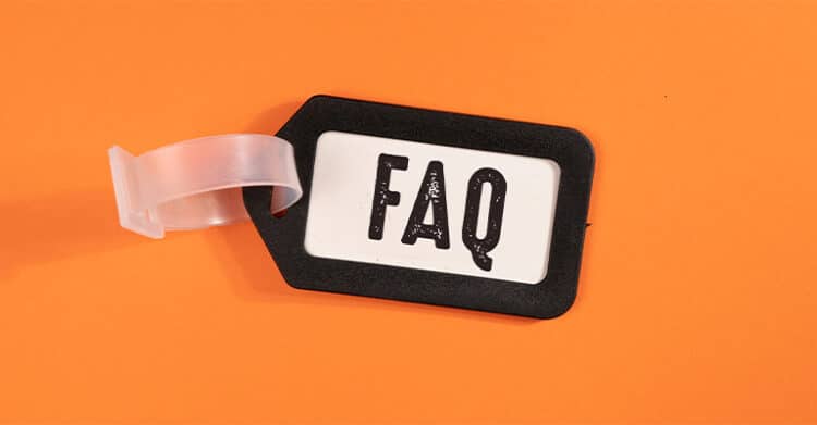 How Does Keyword Length Impact SEO Ranking? 9 A black and white plastic tag with the letters "FAQ" printed in bold, distressed font lies on an orange background. The tag has a transparent loop, suggesting it's meant to label or highlight frequently asked questions.