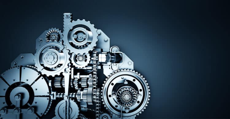 A complex arrangement of silver gears and mechanical components set against a dark gradient background. The image conveys precision, engineering, and interconnected systems, symbolizing how different parts work together in harmony.