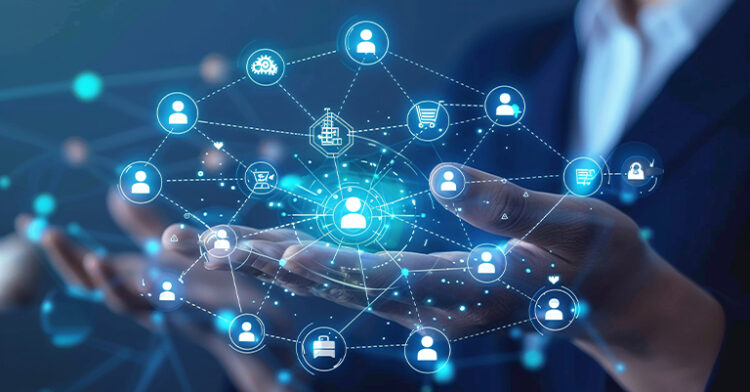 Social Commerce 101: How to Sell on Social Media 9 Hands holding a digital network of icons representing connections in a business ecosystem.
