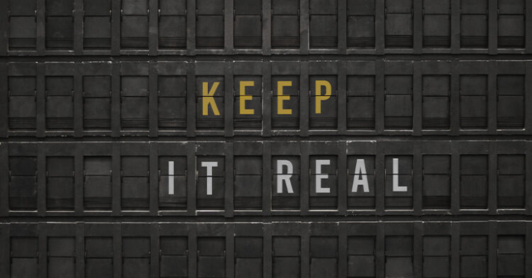 The phrase "KEEP IT REAL" displayed in bold yellow and white text against a textured black background.