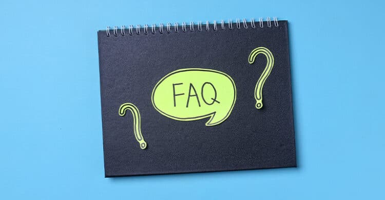 A black spiral notebook with a bright green speech bubble reading “FAQ” and two large question marks sits on a light blue background. The image visually represents a frequently asked questions section, which can support clarity in topics like social media promotion.