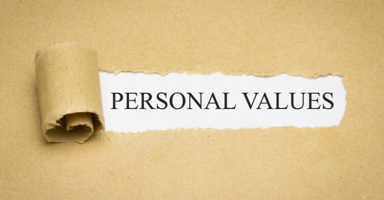 Torn paper revealing the words "Personal Values" on a white background.