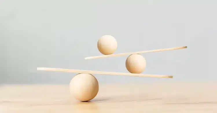 How to Manage Your Online Identity: The Ultimate Guide 6 Wooden spheres and planks carefully balanced to create a minimalist structure symbolizing harmony and stability.