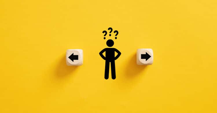 A confused figure between two directional arrows on wooden blocks, symbolizing decision-making challenges and attribution model selection dilemmas.