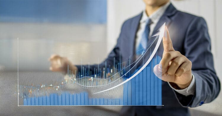 Business professional analyzing a rising bar and line graph, symbolizing influencer ROI growth and digital success metrics.