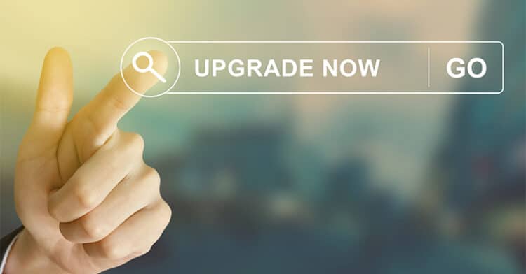 A person’s hand pointing to a digital interface with a search icon, the text “Upgrade Now,” and a “Go” button, suggesting a call-to-action for improvement.
