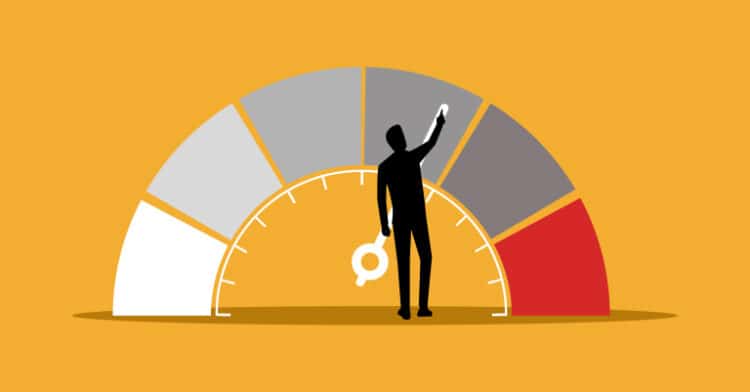 Silhouette of a person adjusting a performance gauge with a key on a yellow background.