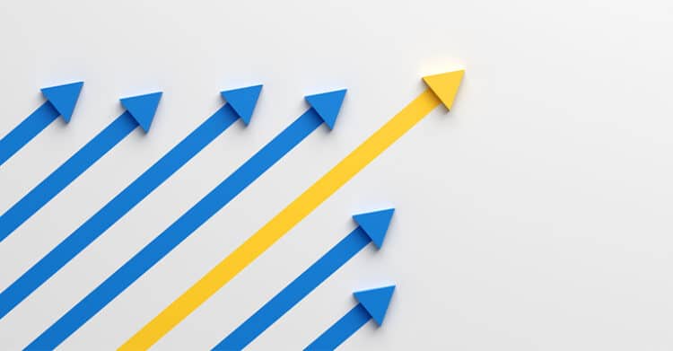 Undergrad Branding: How to Stand Out from the Crowd 4 Multiple blue arrows move upward in parallel while one yellow arrow rises higher in a different direction on a gray background. This visual represents undergrad branding by showing differentiation and standing out from competitors.