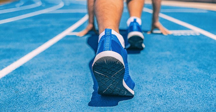 Undergrad Branding: How to Stand Out from the Crowd 8 Close up of a runner’s foot pushing off a track at the starting line with others in position behind. This visual represents undergrad branding by symbolizing momentum, competition, and taking the lead in building a strong identity.