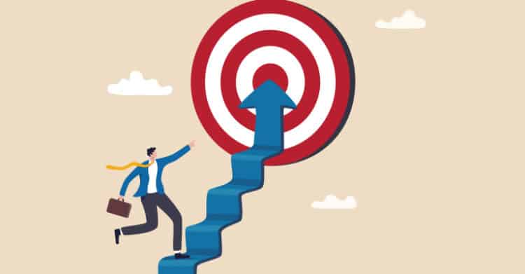 Illustration of audience research as a businessperson runs up a stair shaped arrow toward a red and white target. The image suggests using audience research to focus on the right goal and reach a specific market.