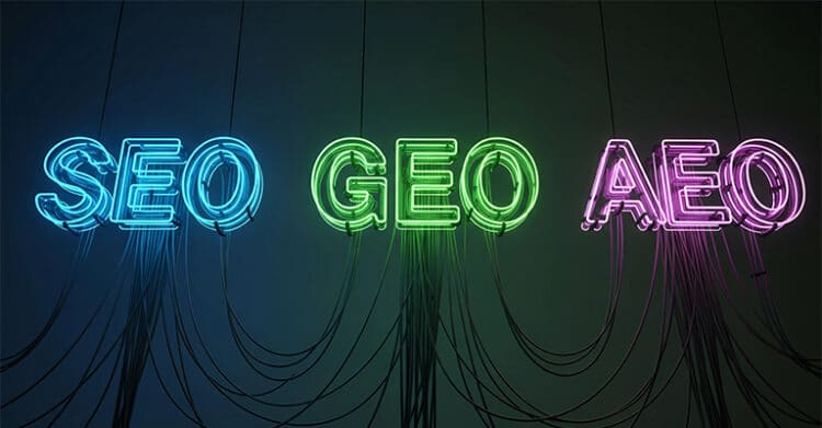 Neon sign on a dark wall with black cords hanging down spells out "SEO GEO AEO" in blue green and pink glowing letters. The bold colorful typography highlights content optimization topics in a modern digital marketing style.