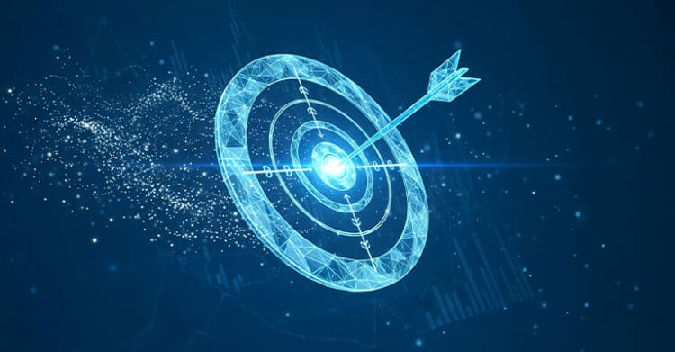 A glowing blue digital target floats against a dark background with an arrow hitting the center bullseye as light particles trail off to the left. The visual reinforces digital strategy by representing clear goals, precision, and focused execution.