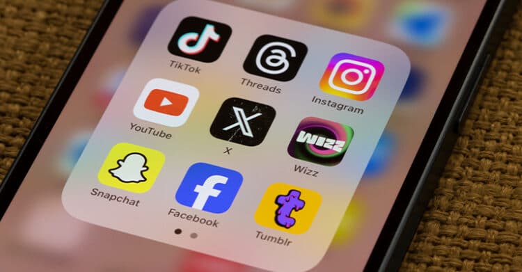 How to Build a Social Media Strategy That Works 4 Smartphone screen displaying social media apps including "TikTok" "Threads" "Instagram" "YouTube" "X" "Wizz" "Snapchat" "Facebook" and "Tumblr." This visual supports a social media strategy by showing the platforms used to share content and engage different audiences.