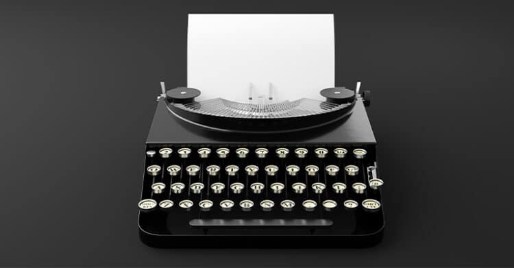 How to Write Blog Titles that Earn Clicks (A Complete Guide) 4 Black vintage typewriter centered on a dark background with a blank sheet of paper loaded into it. This simple visual fits a post about Blog Titles by suggesting the first stage of writing and brainstorming a strong headline.