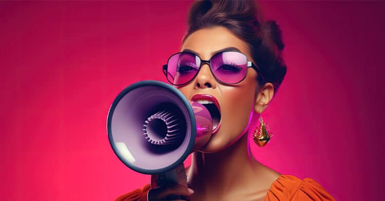 Stylish woman in oversized sunglasses and bold makeup shouts into a megaphone against a bright pink background. The dramatic, attention grabbing pose and vibrant colors suggest influencer marketing and making an announcement to an online audience.
