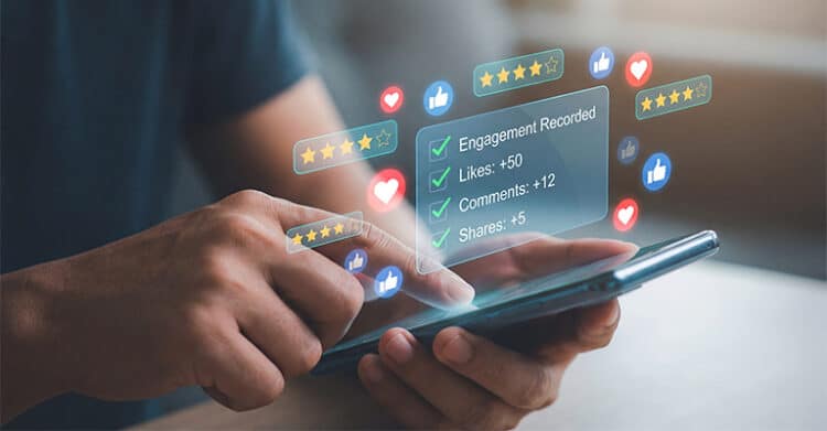 Person using a smartphone with floating reaction icons, star ratings, and a transparent analytics panel showing "Engagement Recorded," "Likes: +50," "Comments: +12," and "Shares: +5." This concept graphic represents strategies to increase social media engagement by showing real time audience interaction and performance metrics.