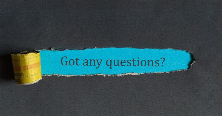 Torn dark paper reveals a bright blue strip with the words "Got any questions?" in the center. This graphic supports content about how to increase social media engagement by encouraging audience interaction through direct questions and conversation starters.