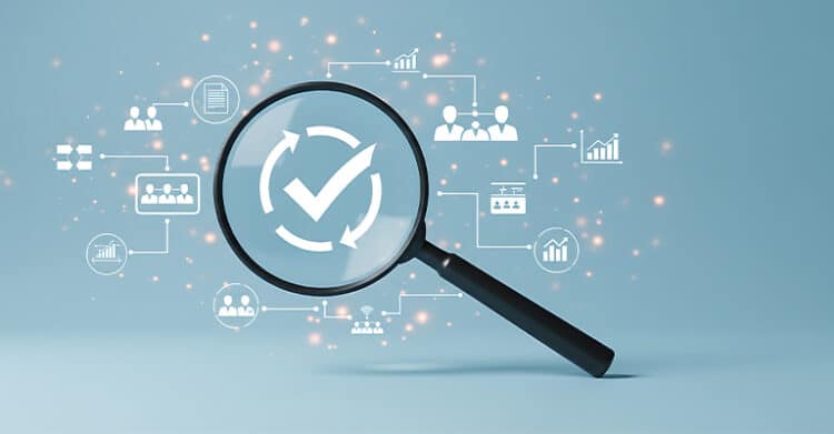Magnifying glass highlights a white checkmark and circular arrows on a blue background with connected icons for charts teams documents and analytics. The illustration suggests auditing content signals for answer engine optimization and trustworthy results.