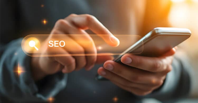 Mobile-First Indexing: How to Prepare Your Website & Content 5 Close up of a person using a smartphone while tapping a glowing search bar labeled “SEO.” The mobile search visual supports mobile-first indexing by showing SEO activity happening on a phone instead of a desktop.